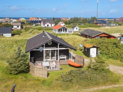 Lille og særdeles hyggeligt sommerhus ved Lild Strand