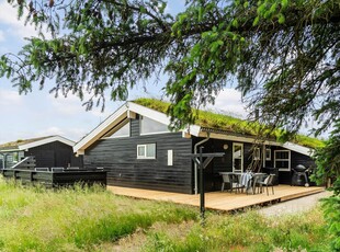 Dejligt sommerhus med vildmarksbad og teenageafdeling i naturskønne Saltum