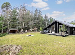 Charmerende sommerhus fuld af hygge og varm atmosfære.