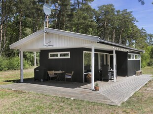 Dejligt sommerhus i træ.