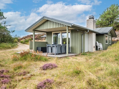 Feriehus beliggende på en pragtfuld naturgrund i en 'gryde'.