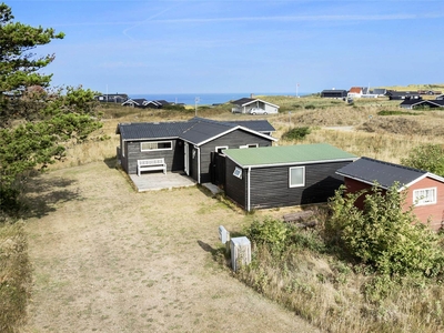 Hyggeligt sommerhus med havkig