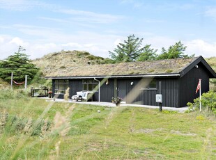 Charmerende træsommerhus med ugeneret adresse mellem klitterne